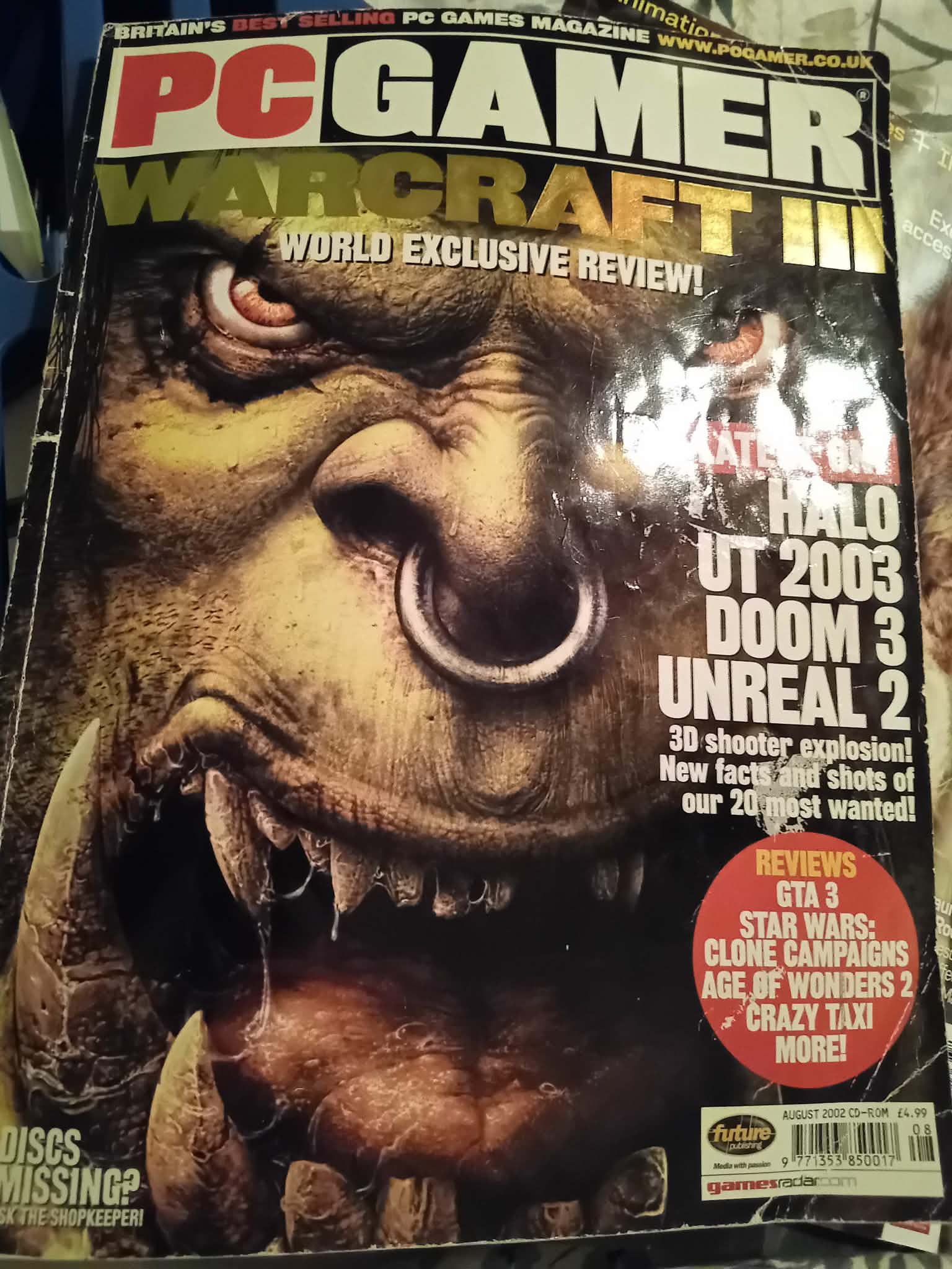 Front cover of PC Gamer magazine dated 2002 with Warcraft three image of an ork